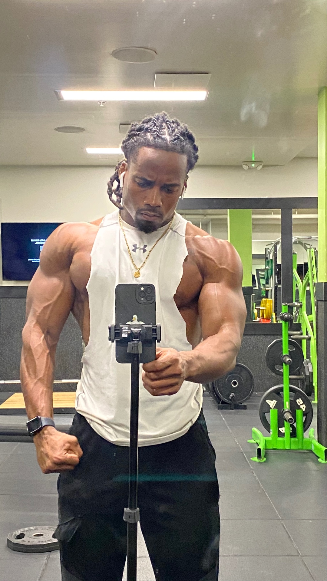 Nate flexing arms in a training tank